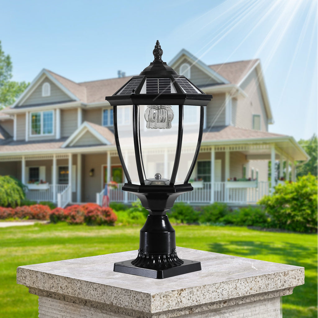 Ornate Victorian solar pillar light on a stone gate post in a sunlit garden